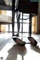 A pair of black shoes sitting on top of a table.