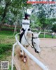 A woman riding on the back of a white horse.