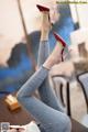 a woman sitting on top of a table with her legs up