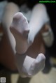 A close up of a person's feet in white socks.